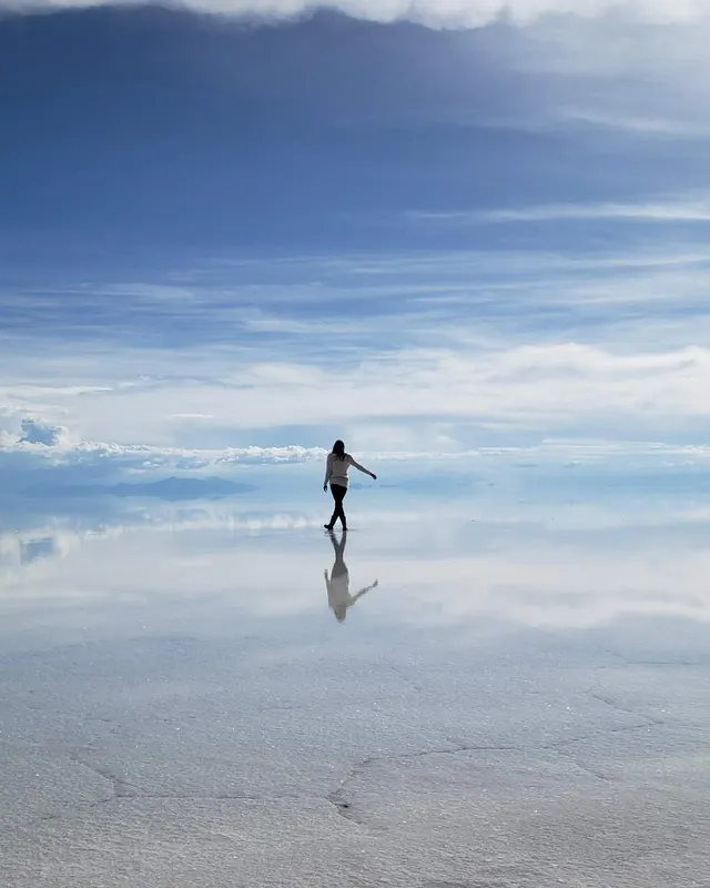Catherine walking on the salt flat in Bolivia