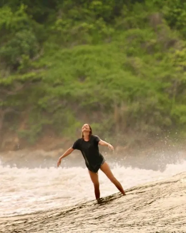 Catherine surfing in Lombok, Indonesia